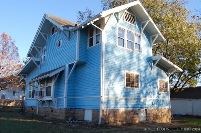 view of side of property with cooling unit