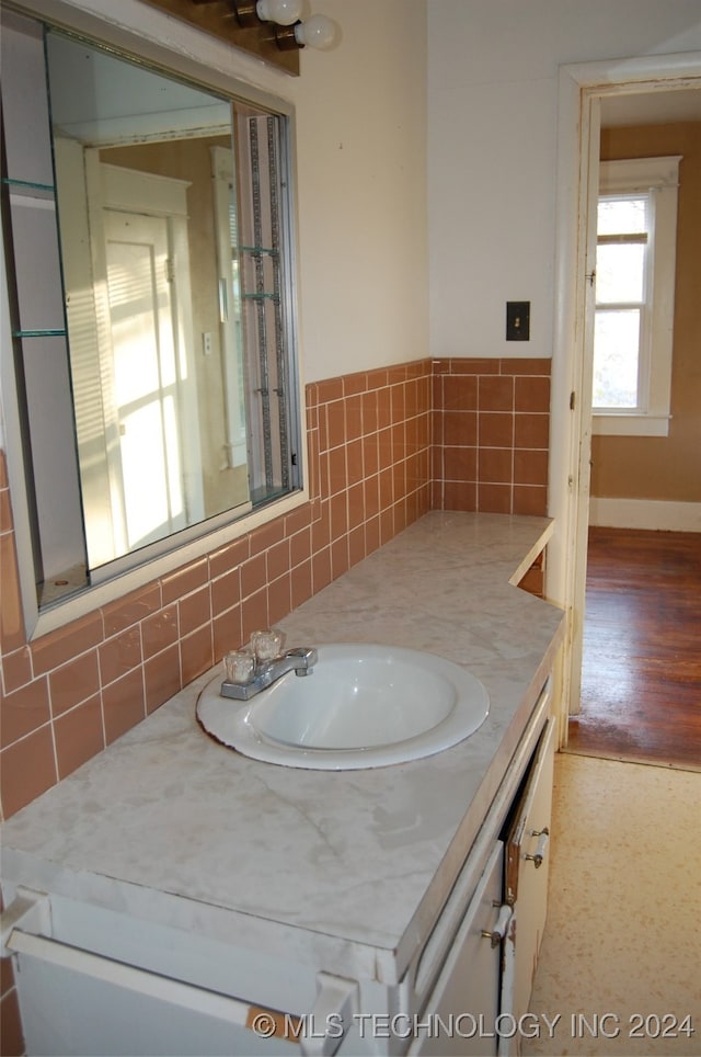 bathroom with hardwood / wood-style floors and vanity