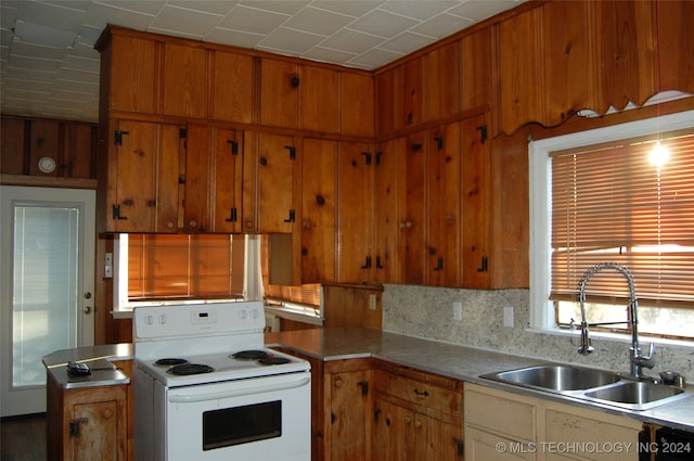 kitchen with decorative backsplash, dishwasher, white electric range, and sink