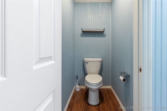 bathroom featuring hardwood / wood-style floors and toilet