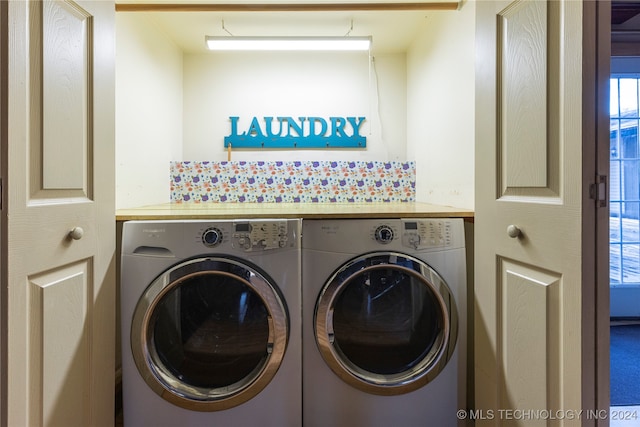 laundry area with washer and clothes dryer