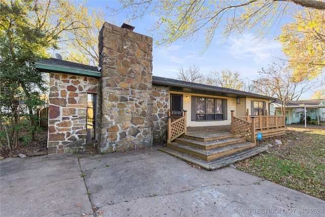 entrance to property with a patio area