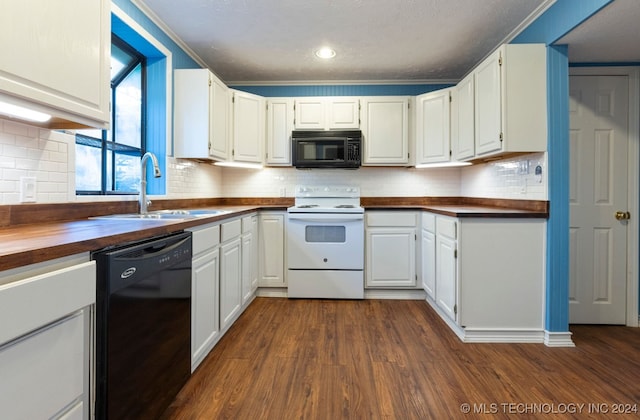 kitchen featuring dark wood-type flooring, white cabinets, black appliances, sink, and butcher block countertops