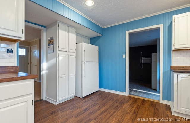 kitchen featuring white cabinets, white fridge, and dark hardwood / wood-style floors