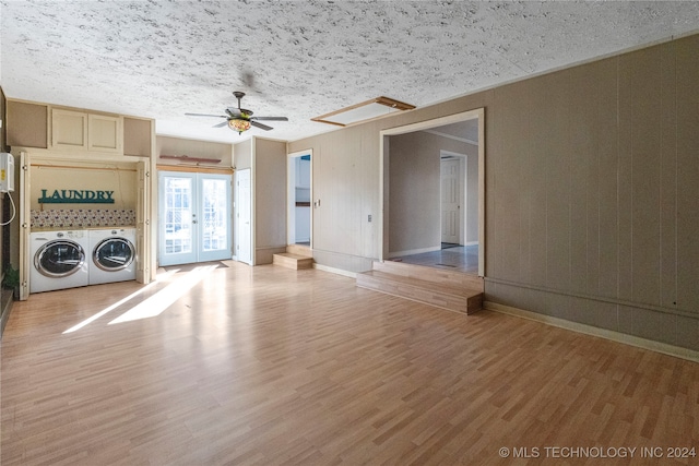 unfurnished living room featuring light hardwood / wood-style flooring and a textured ceiling