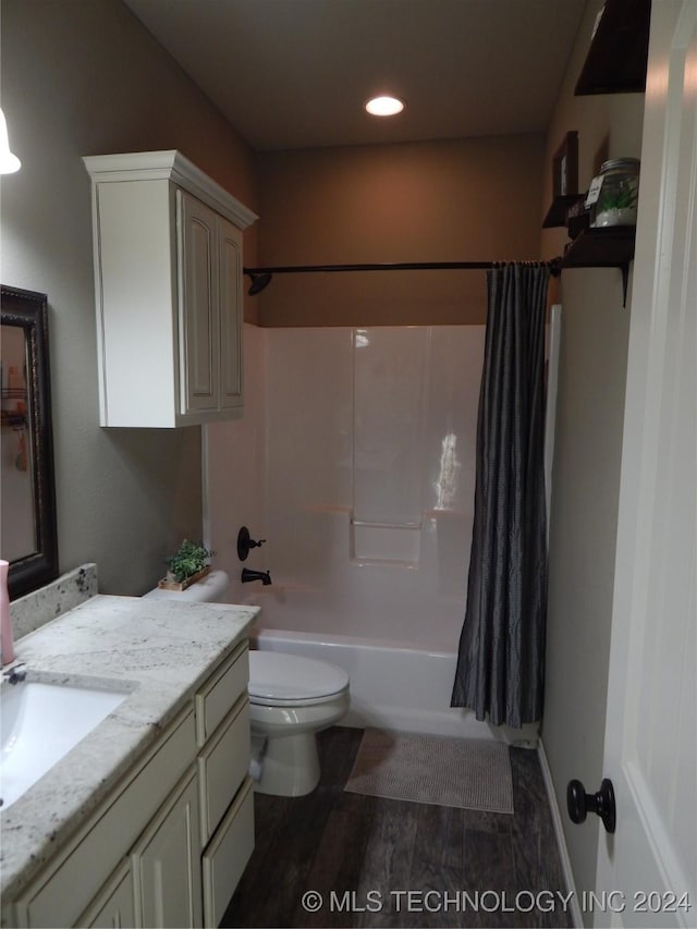 full bathroom featuring shower / bath combination with curtain, vanity, hardwood / wood-style flooring, and toilet