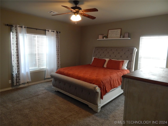 bedroom featuring ceiling fan and dark colored carpet