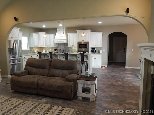 living room featuring dark hardwood / wood-style flooring