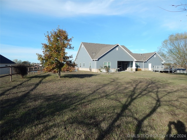 back of house with a yard