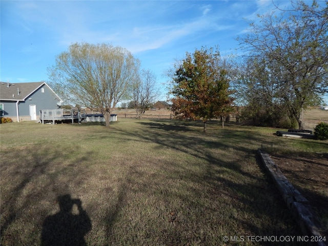 view of yard with a deck