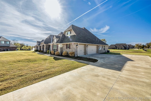 view of property exterior featuring a lawn, a garage, and central air condition unit