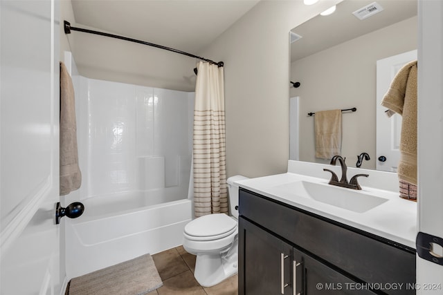 full bathroom with tile patterned floors, vanity, shower / bath combo, and toilet