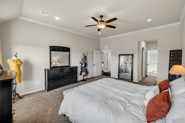 carpeted bedroom with vaulted ceiling, ensuite bath, ceiling fan, and crown molding