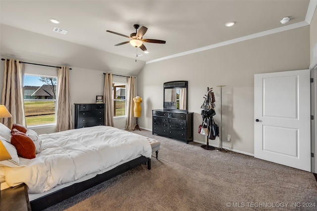 carpeted bedroom with ceiling fan and crown molding