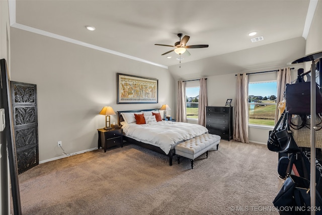 bedroom featuring ceiling fan, crown molding, and carpet floors