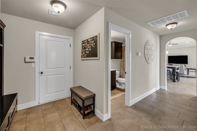 corridor featuring a textured ceiling