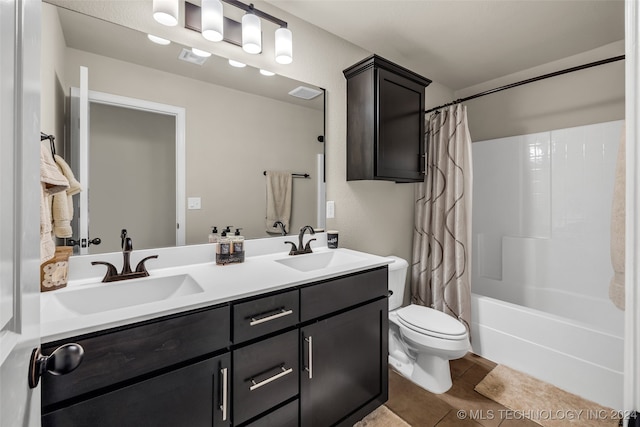 full bathroom featuring tile patterned flooring, shower / bath combination with curtain, toilet, and vanity