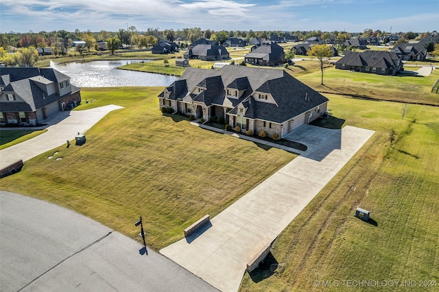 drone / aerial view with a water view