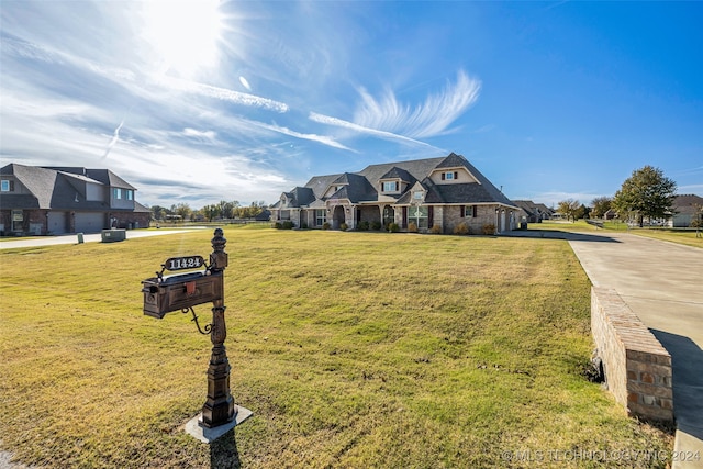 french provincial home featuring a front yard