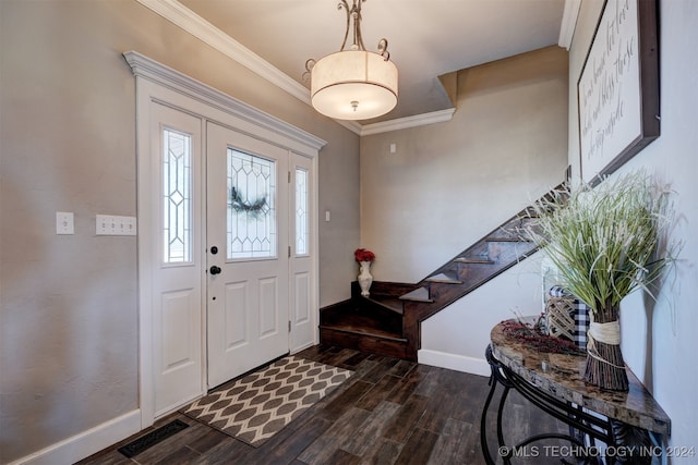 foyer featuring ornamental molding and dark wood-type flooring