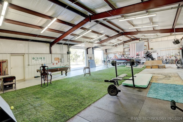 garage with a lawn and a garage door opener