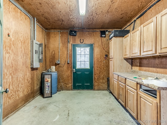 interior space with electric panel, wood walls, and wood ceiling