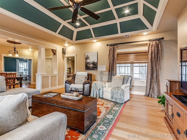 living room with ornate columns, ceiling fan, light hardwood / wood-style floors, and coffered ceiling