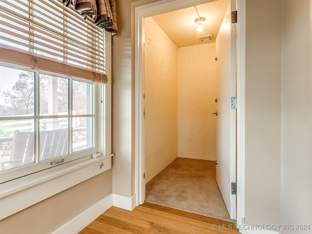 corridor featuring light hardwood / wood-style flooring