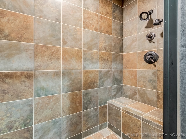 bathroom with a tile shower