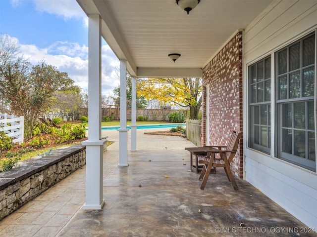 view of patio / terrace featuring a fenced in pool