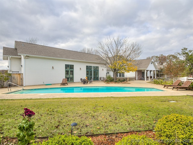 view of pool with a yard and a patio area