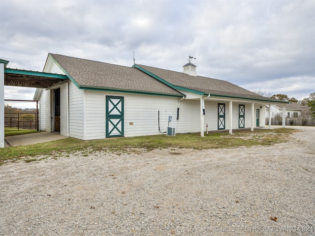 ranch-style house with central AC unit