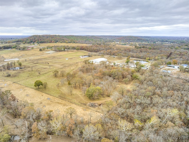 birds eye view of property with a rural view