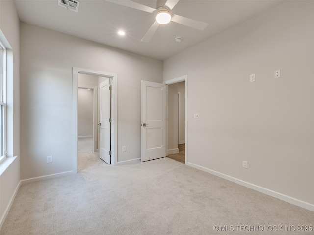 unfurnished bedroom with recessed lighting, visible vents, light carpet, and baseboards