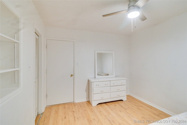 bedroom featuring light hardwood / wood-style floors and ceiling fan