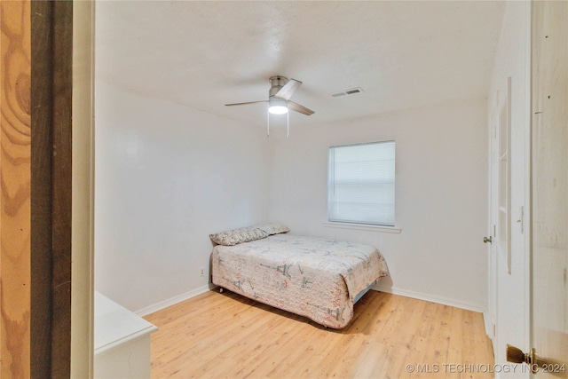 bedroom featuring light wood-type flooring and ceiling fan