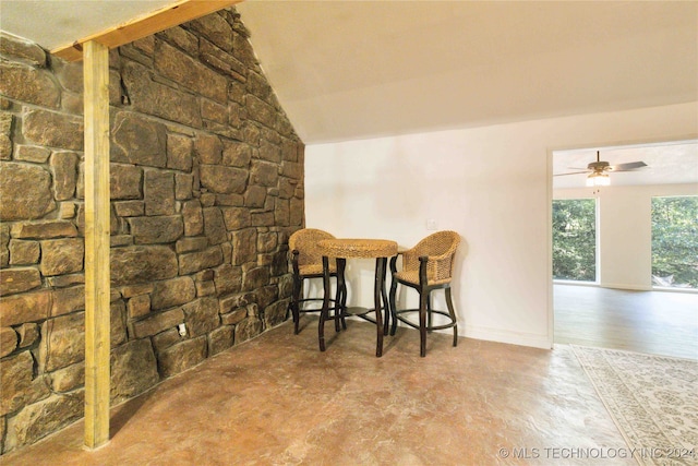 dining room with ceiling fan and vaulted ceiling