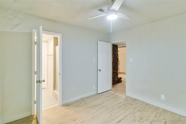 unfurnished bedroom with ensuite bathroom, light hardwood / wood-style flooring, and ceiling fan