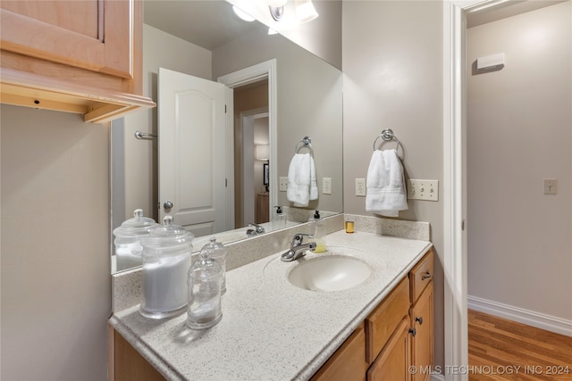 bathroom featuring hardwood / wood-style floors and vanity