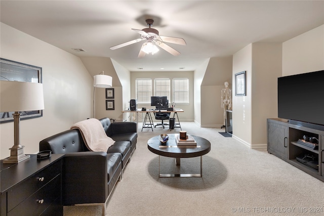 living room with light carpet and ceiling fan