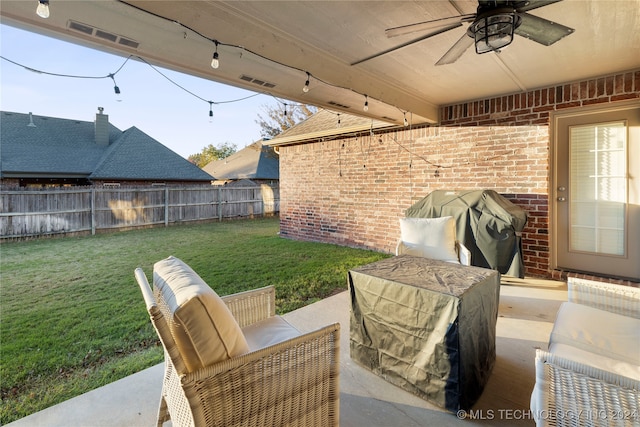 view of patio featuring area for grilling and ceiling fan