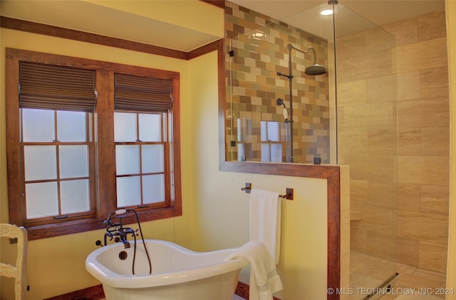 bathroom with shower with separate bathtub