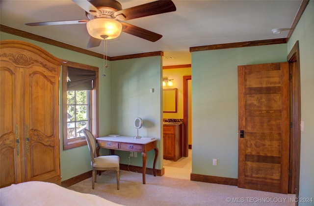 carpeted bedroom with connected bathroom, ceiling fan, and ornamental molding