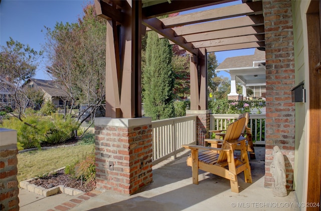 view of patio featuring a porch and a pergola