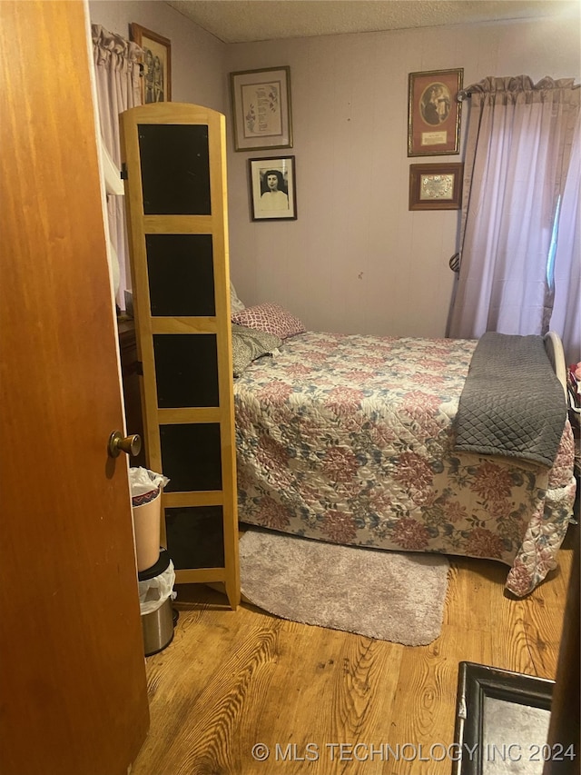 bedroom featuring wood-type flooring