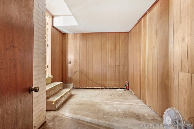 interior space featuring wood walls