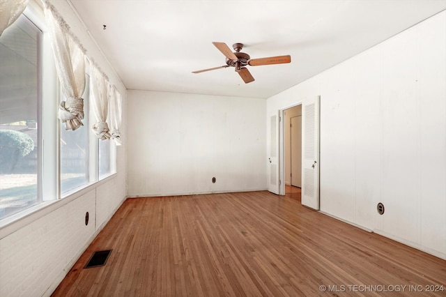 spare room featuring ceiling fan and hardwood / wood-style floors