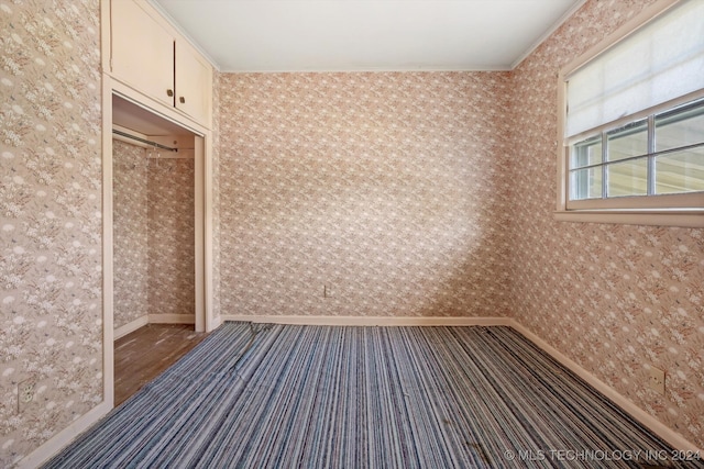 empty room featuring ornamental molding