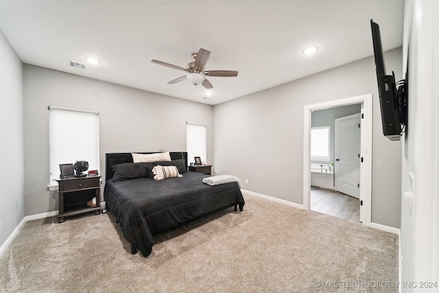 bedroom featuring ceiling fan and light carpet