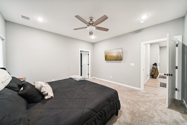 carpeted bedroom with ceiling fan